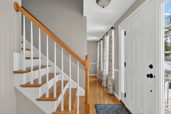 a view of entryway with wooden floor