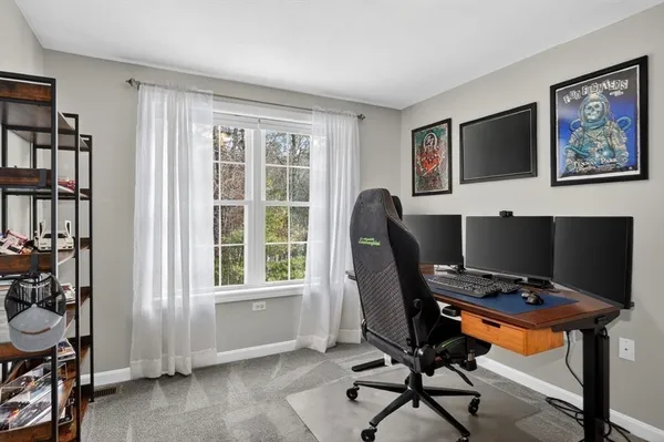 a workspace with furniture and a window