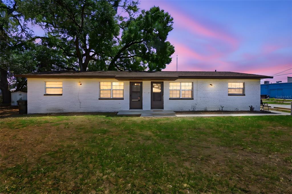 1201 Buddwood Road Lakeland, FL 33801 - Photo 1 of 1 a front view of a house with a garden