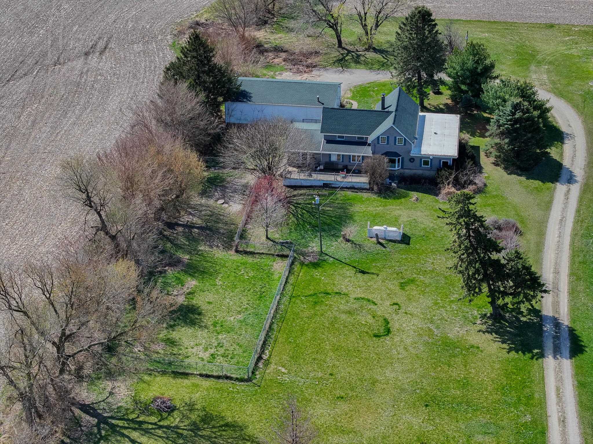 13965 East Dutch Road Rochelle, IL 61068 - Photo 35 of 50 a aerial view of a house with a yard