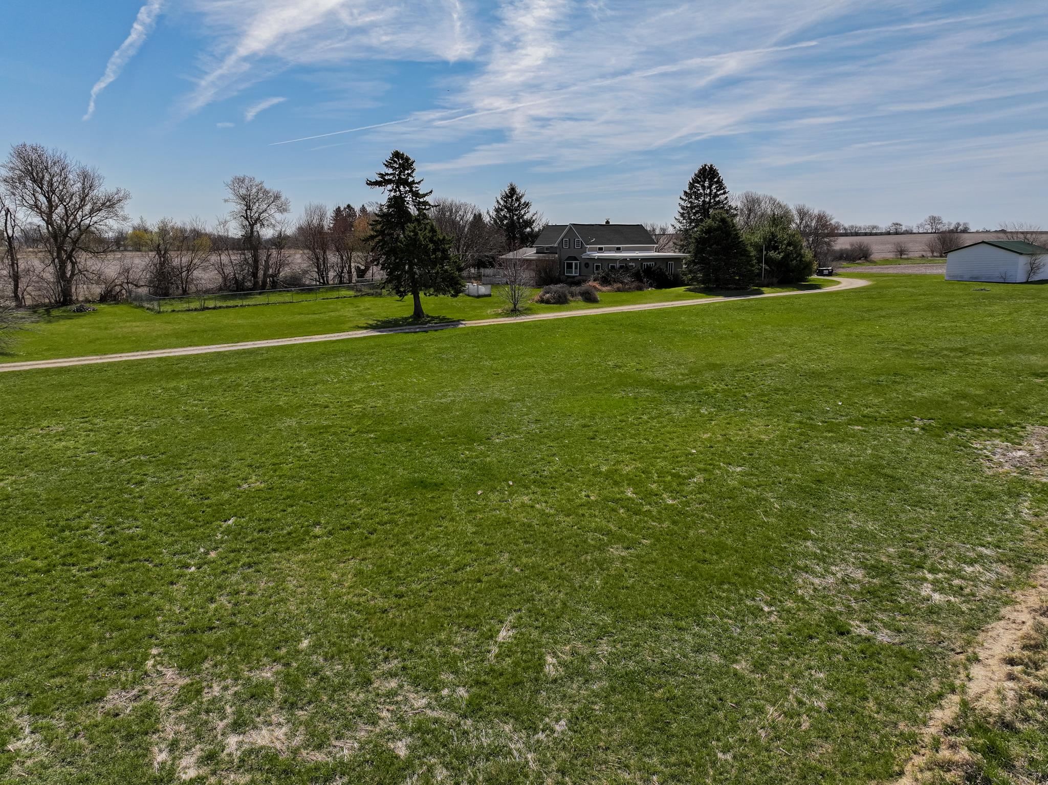13965 East Dutch Road Rochelle, IL 61068 - Photo 36 of 50 a view of a golf course with a lake