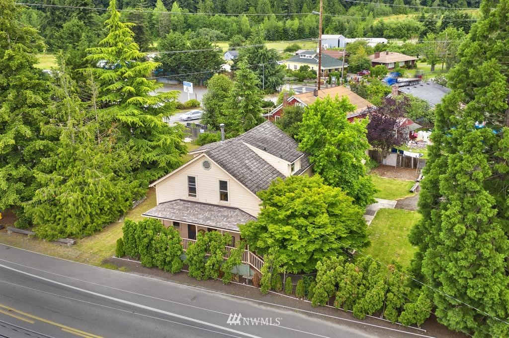 an aerial view of a house with a yard and garden view