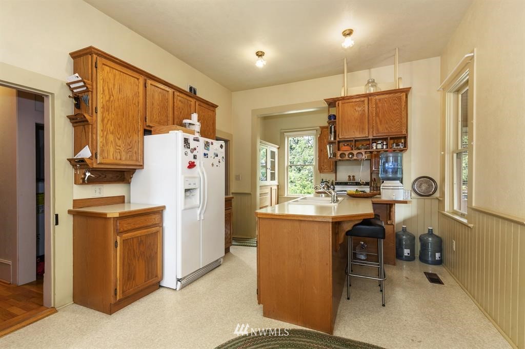 31 Center Road Chimacum, WA 98325 - Photo 13 of 35 a kitchen with refrigerator a washer and dryer