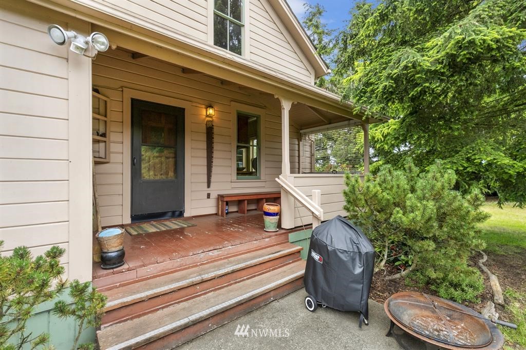 31 Center Road Chimacum, WA 98325 - Photo 17 of 35 a view of a patio with a chairs and table in a patio