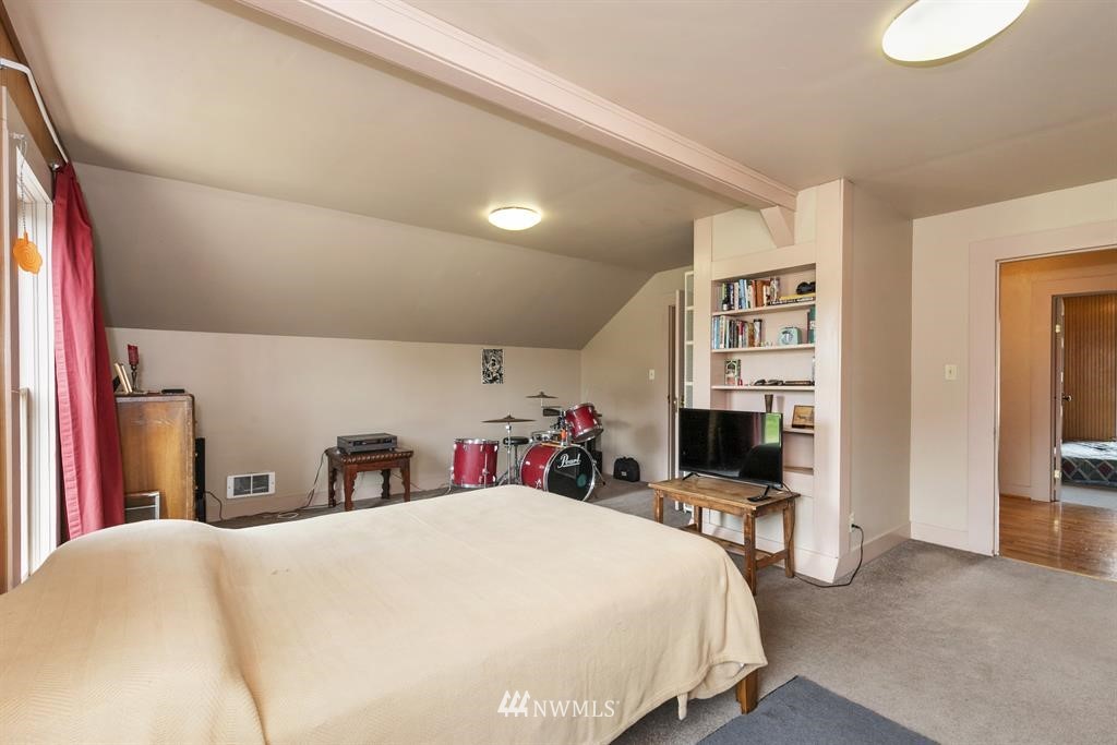 31 Center Road Chimacum, WA 98325 - Photo 24 of 35 a bed room with a bed and a chair