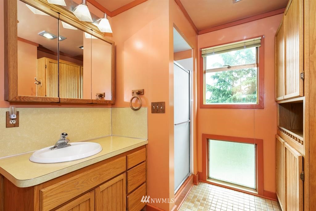 31 Center Road Chimacum, WA 98325 - Photo 27 of 35 a bathroom with a sink and a mirror