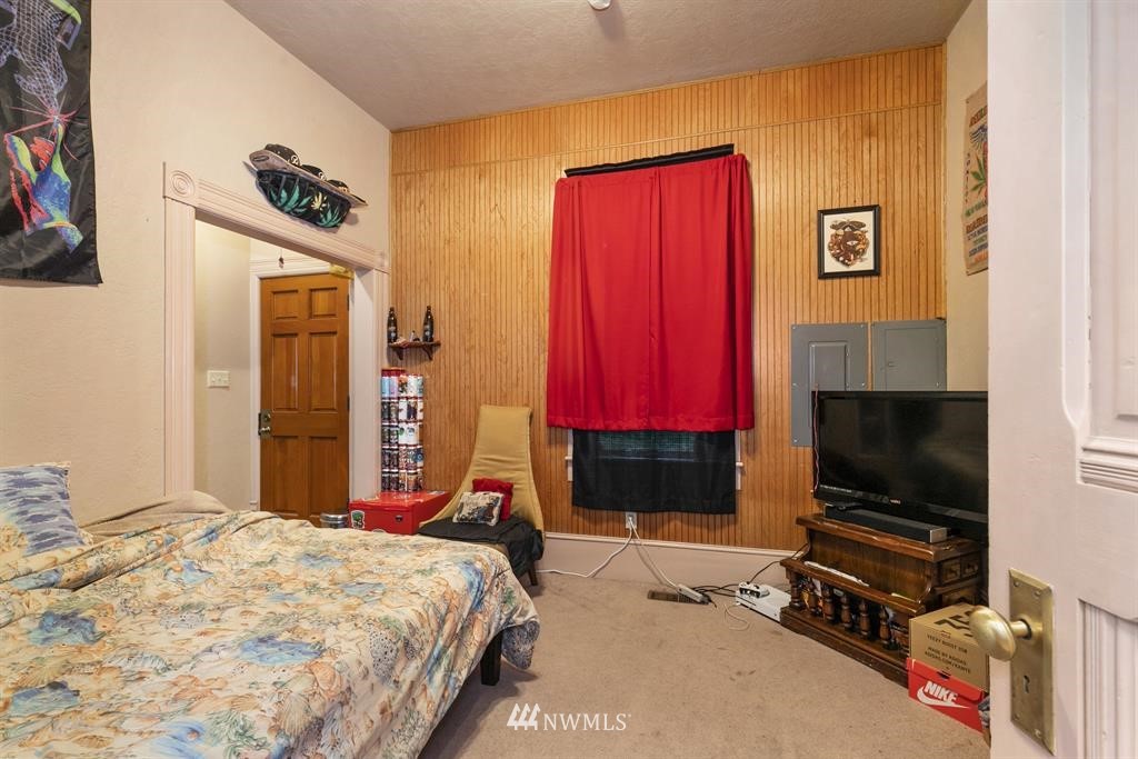 31 Center Road Chimacum, WA 98325 - Photo 31 of 35 a bedroom with a bed and a flat screen tv
