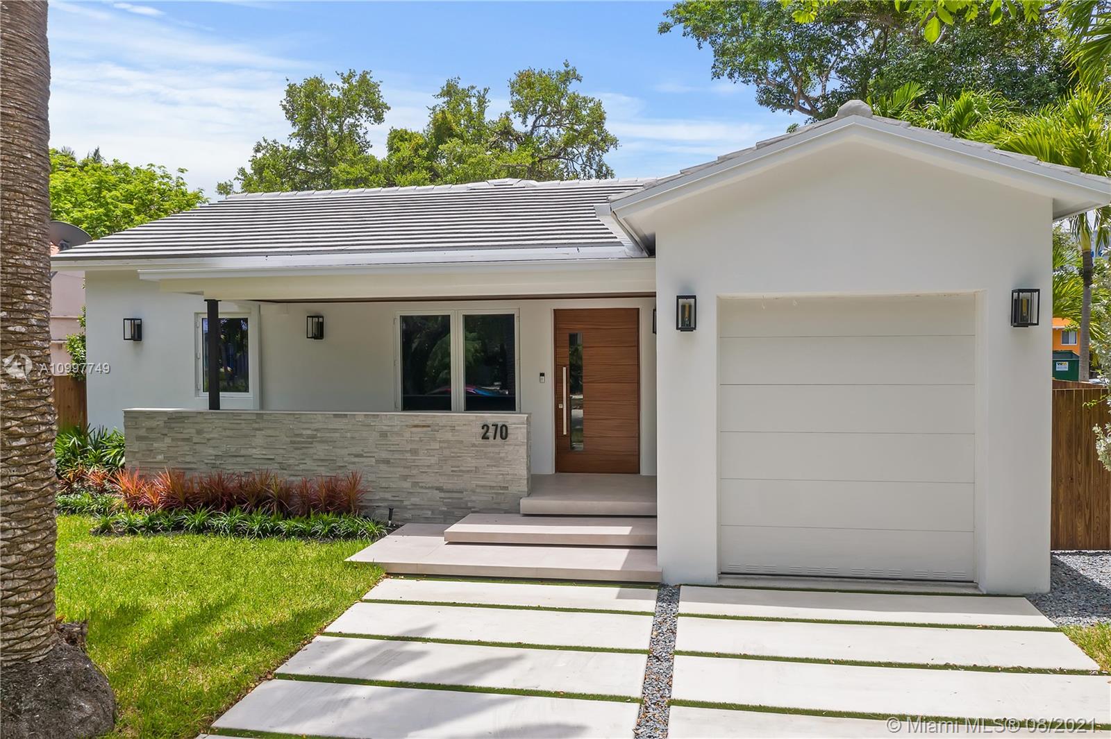 270 Southwest 29th Road Miami, FL 33129 - Photo 4 of 48 a front view of a house with a yard