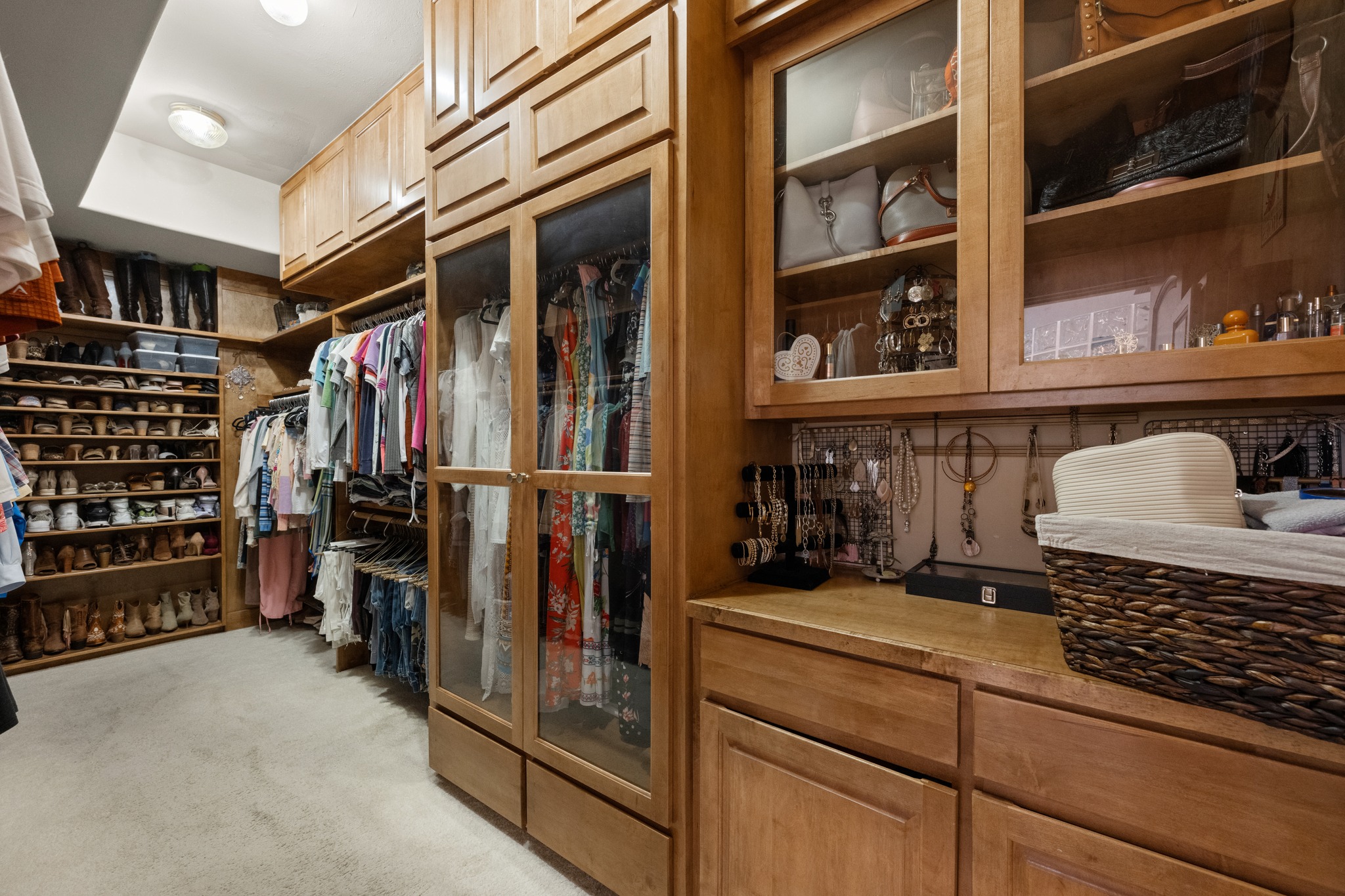 407 Hurst Creek Road Lakeway, TX 78734 - Photo 19 of 40 Wow! This is a closet most people could only dream of. Custom cabinetry built to display, protect, and organize your belongings.