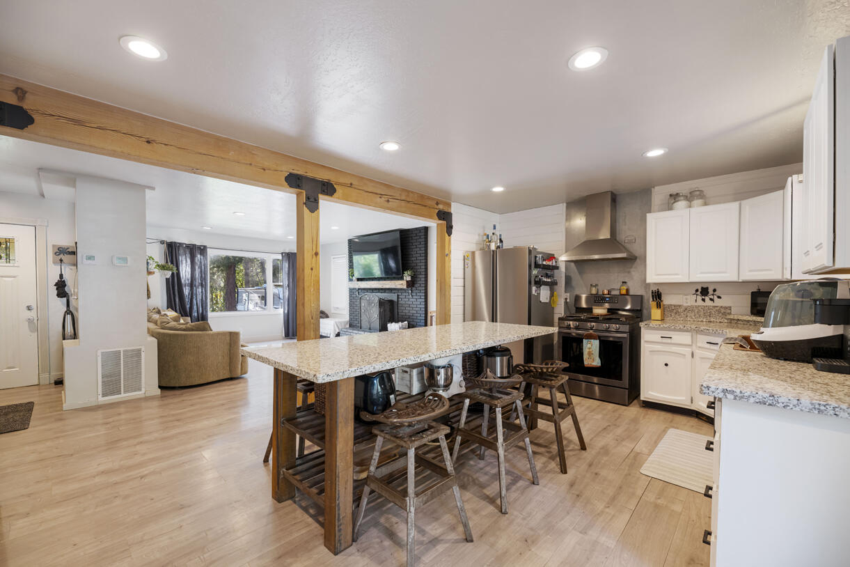 6324 East Evans Creek Road Rogue River, OR 97537 - Photo 11 of 31 a large kitchen with a table and chairs