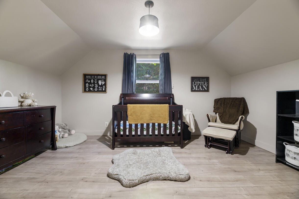 6324 East Evans Creek Road Rogue River, OR 97537 - Photo 14 of 31 a bedroom with a bed and a chair