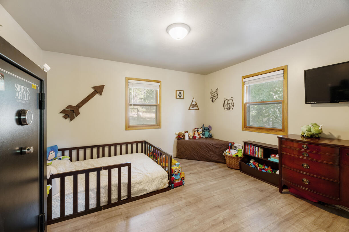 6324 East Evans Creek Road Rogue River, OR 97537 - Photo 15 of 31 a bed room with furniture and a window