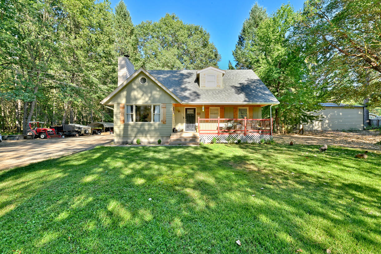 6324 East Evans Creek Road Rogue River, OR 97537 - Photo 21 of 31 a front view of a house with a garden and trees