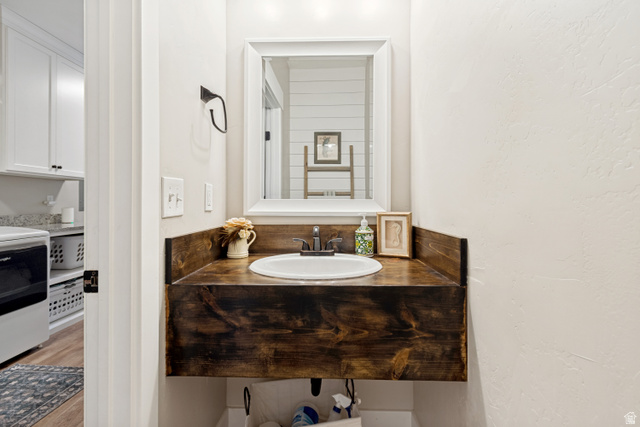 332 South 500 West Payson, UT 84651 - Photo 21 of 50 Floating wood-finish vanity with an integrated sink and wall-mounted mirror in half bath