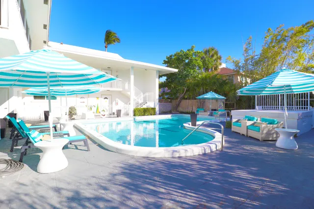 a view of a swimming pool with a patio