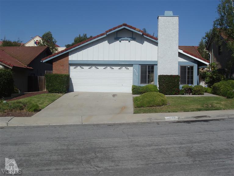 4376 Laurelhurst Road Moorpark, CA 93021 - Photo 1 of 10 a front view of a house with a yard and garage
