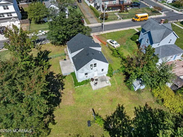 an aerial view of a house with a garden