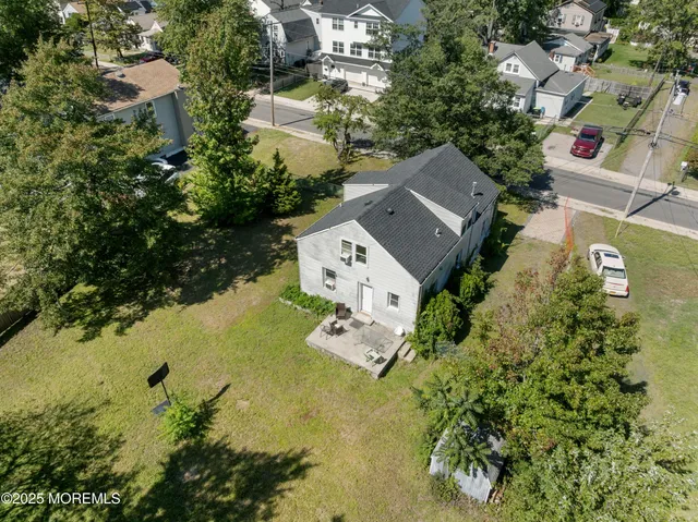 an aerial view of residential house with outdoor space and swimming pool