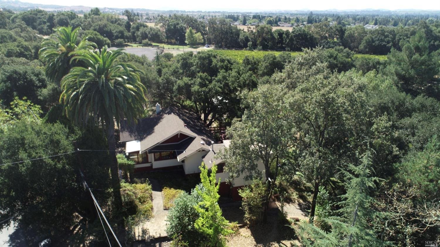 4903 Petaluma Hill Road Santa Rosa, CA 95404 - Photo 1 of 1 an aerial view of a house with a yard
