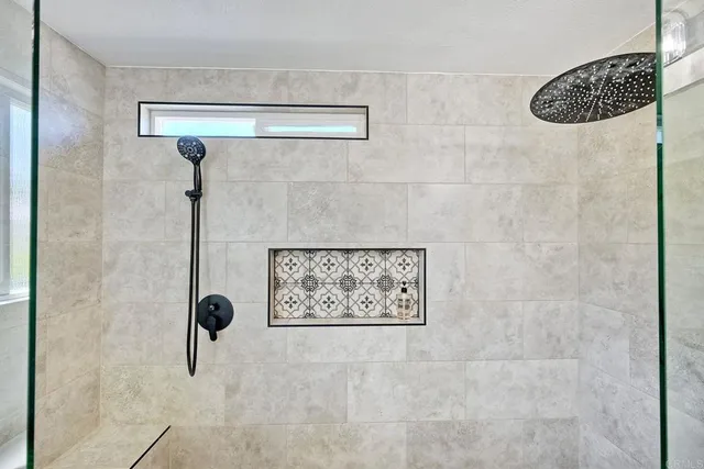 a bathroom with a shower and a sink