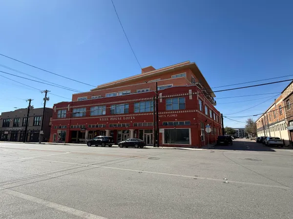 a view of a building with a street