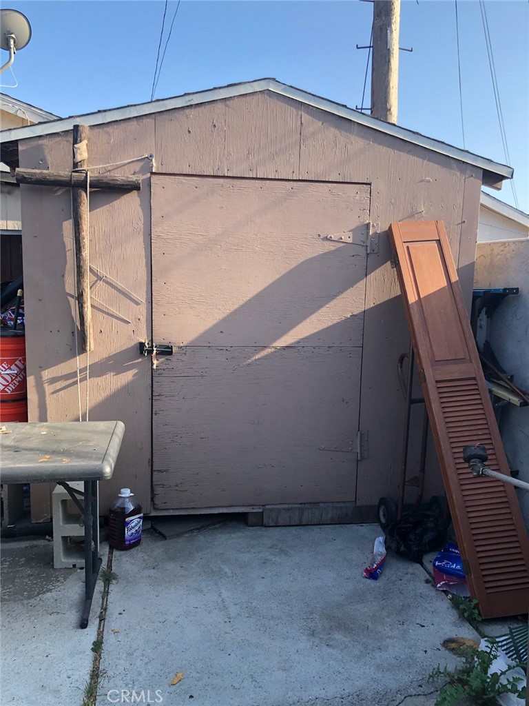 1512 West 152nd Street Compton, CA 90220 - Photo 11 of 14 a view of storage and utility room with two chairs