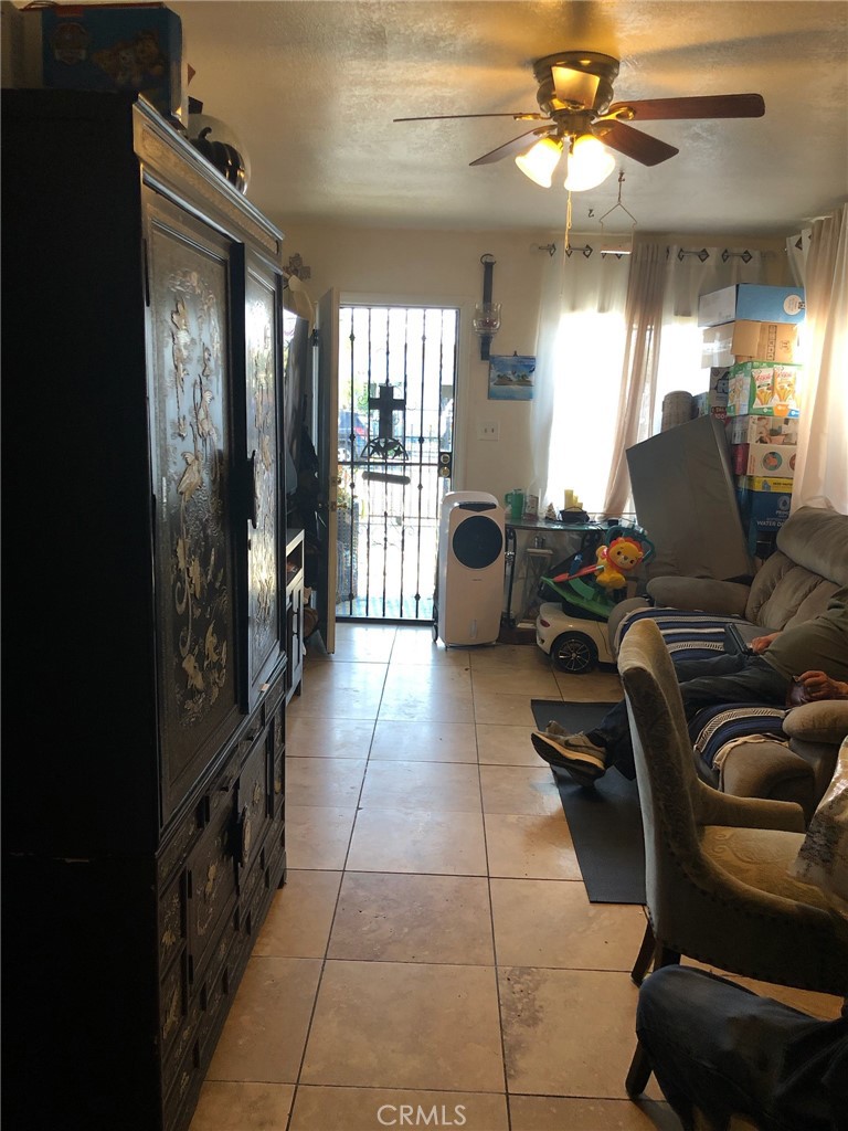 1512 West 152nd Street Compton, CA 90220 - Photo 6 of 14 a room with gym equipment and a large window