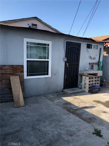 a view of storage and utility room with two chairs