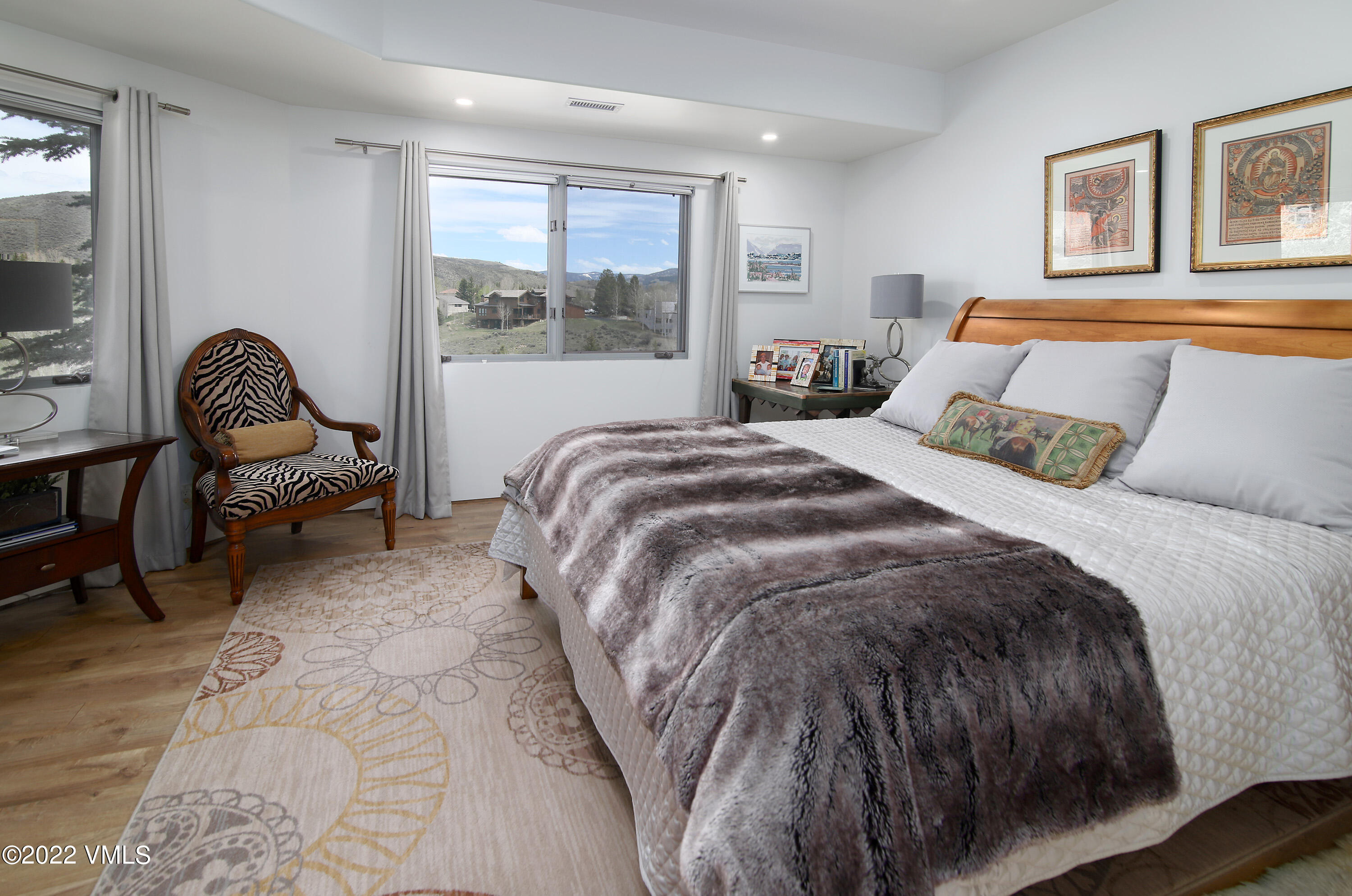 11 Chute Circle Edwards, CO 81632 - Photo 15 of 18 a bedroom with a bed chair and painting on the wall