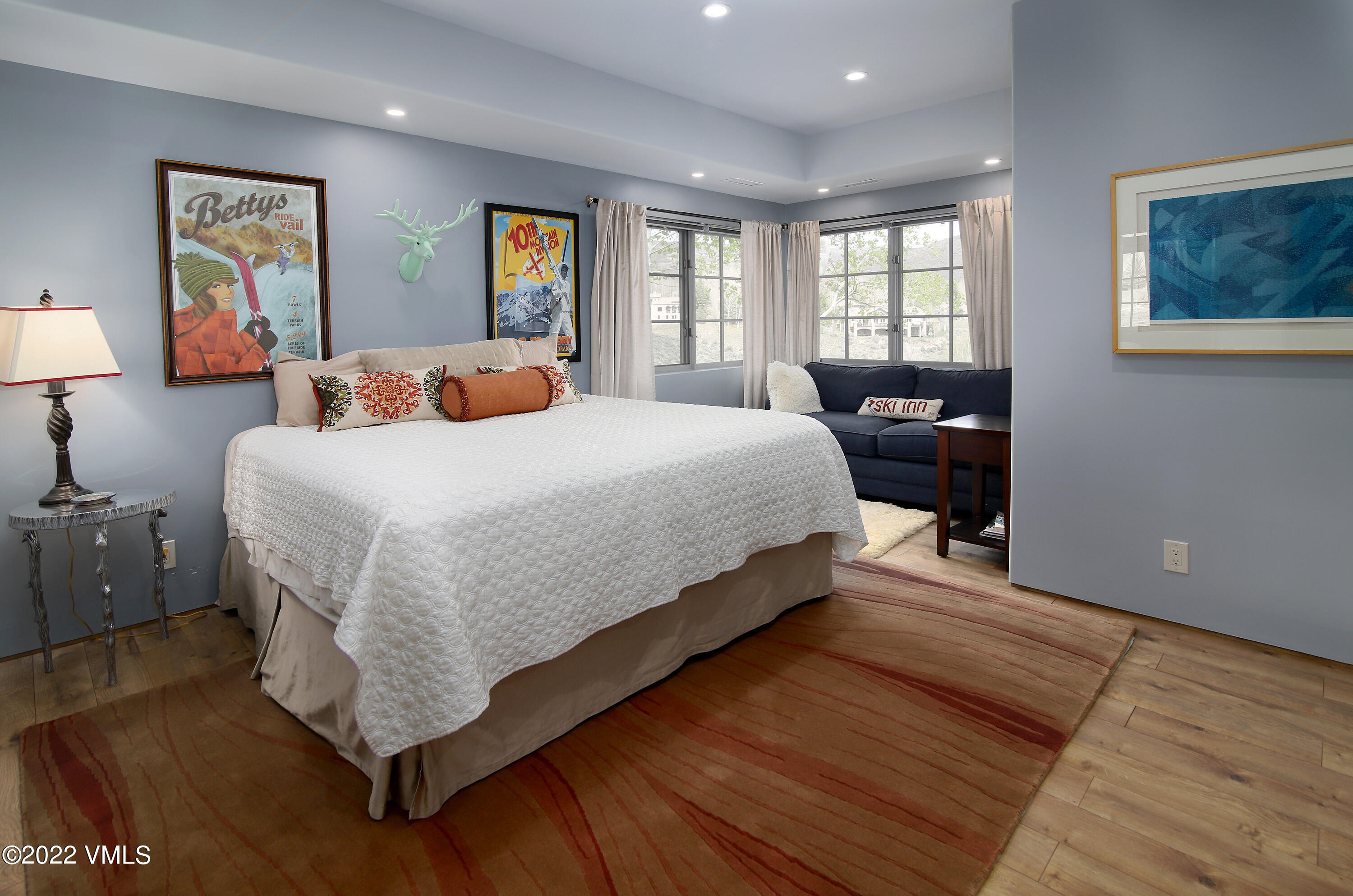 11 Chute Circle Edwards, CO 81632 - Photo 16 of 18 a large bedroom with a bed and wooden floor