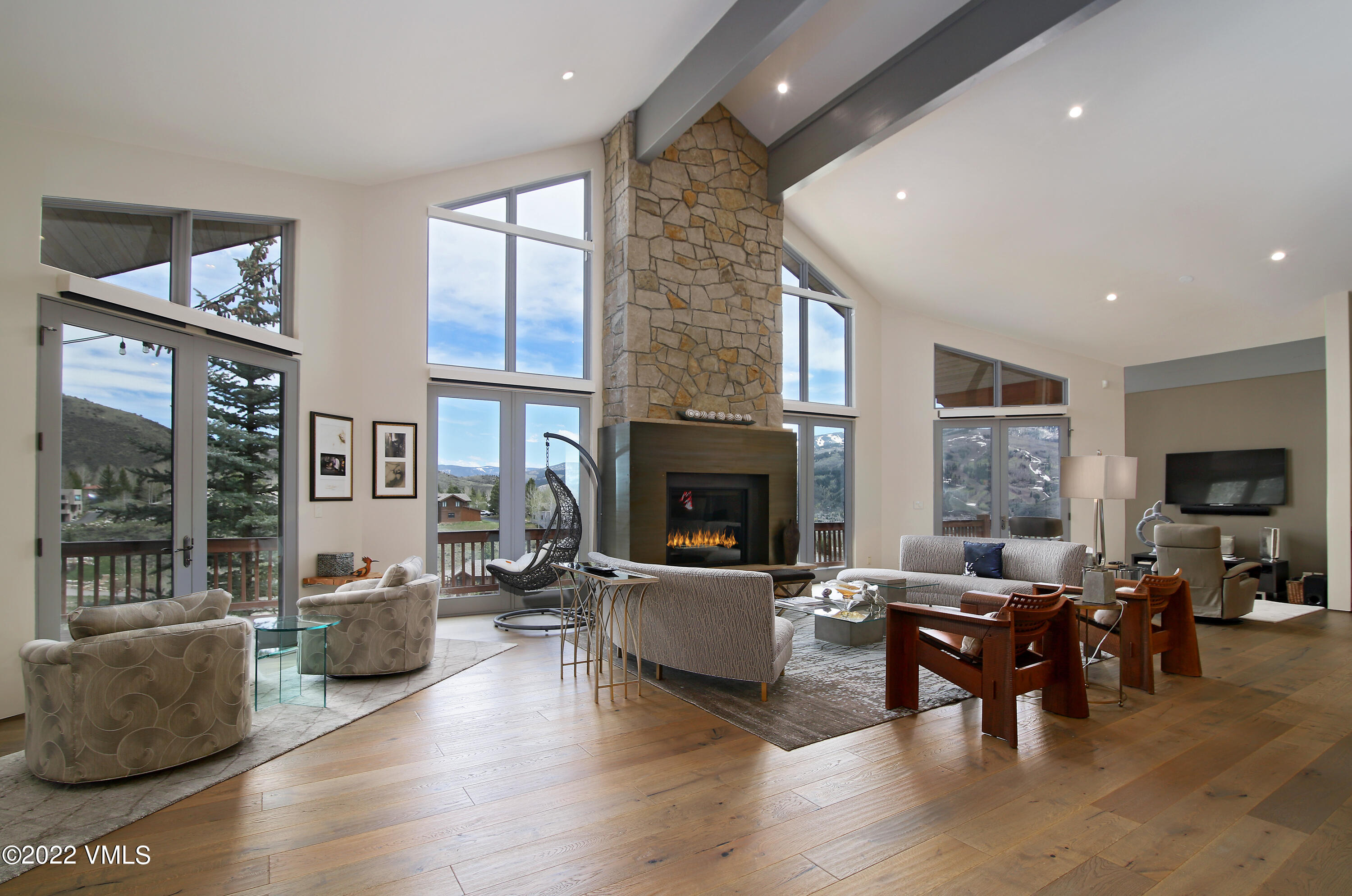 11 Chute Circle Edwards, CO 81632 - Photo 3 of 18 a living room with fireplace furniture and a large window