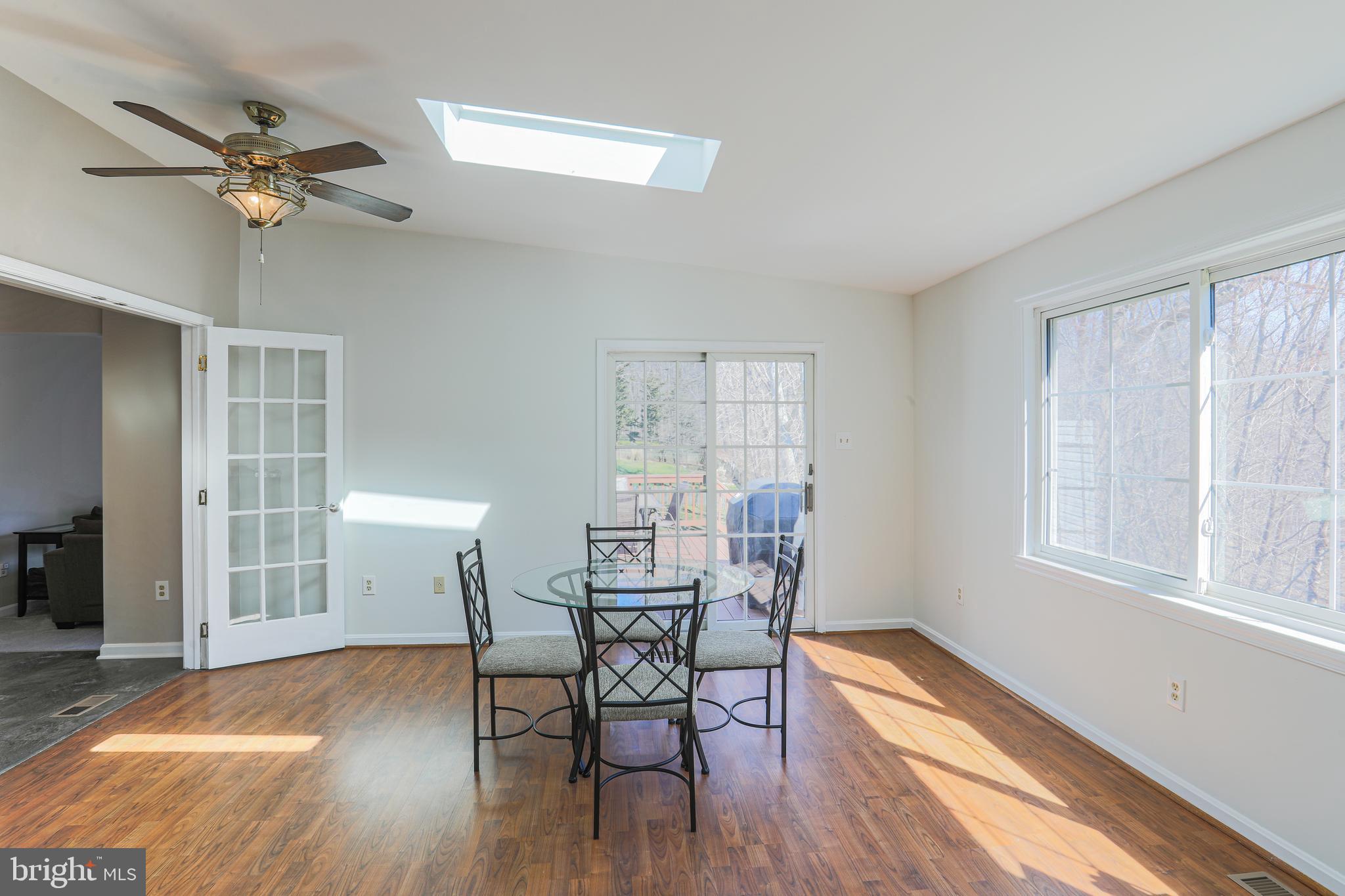 9547 Hallhurst Road Baltimore, MD 21236 - Photo 19 of 49 a view of a room with furniture and wooden floor