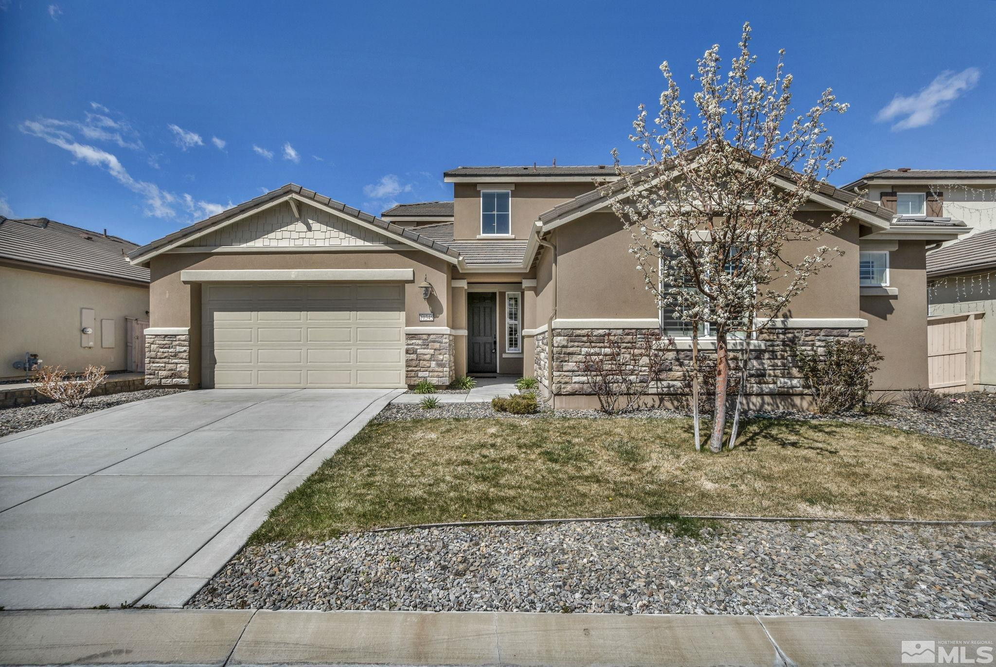10345 Rollins Drive Reno, NV 89521 - Photo 1 of 39 front view of a house with a yard
