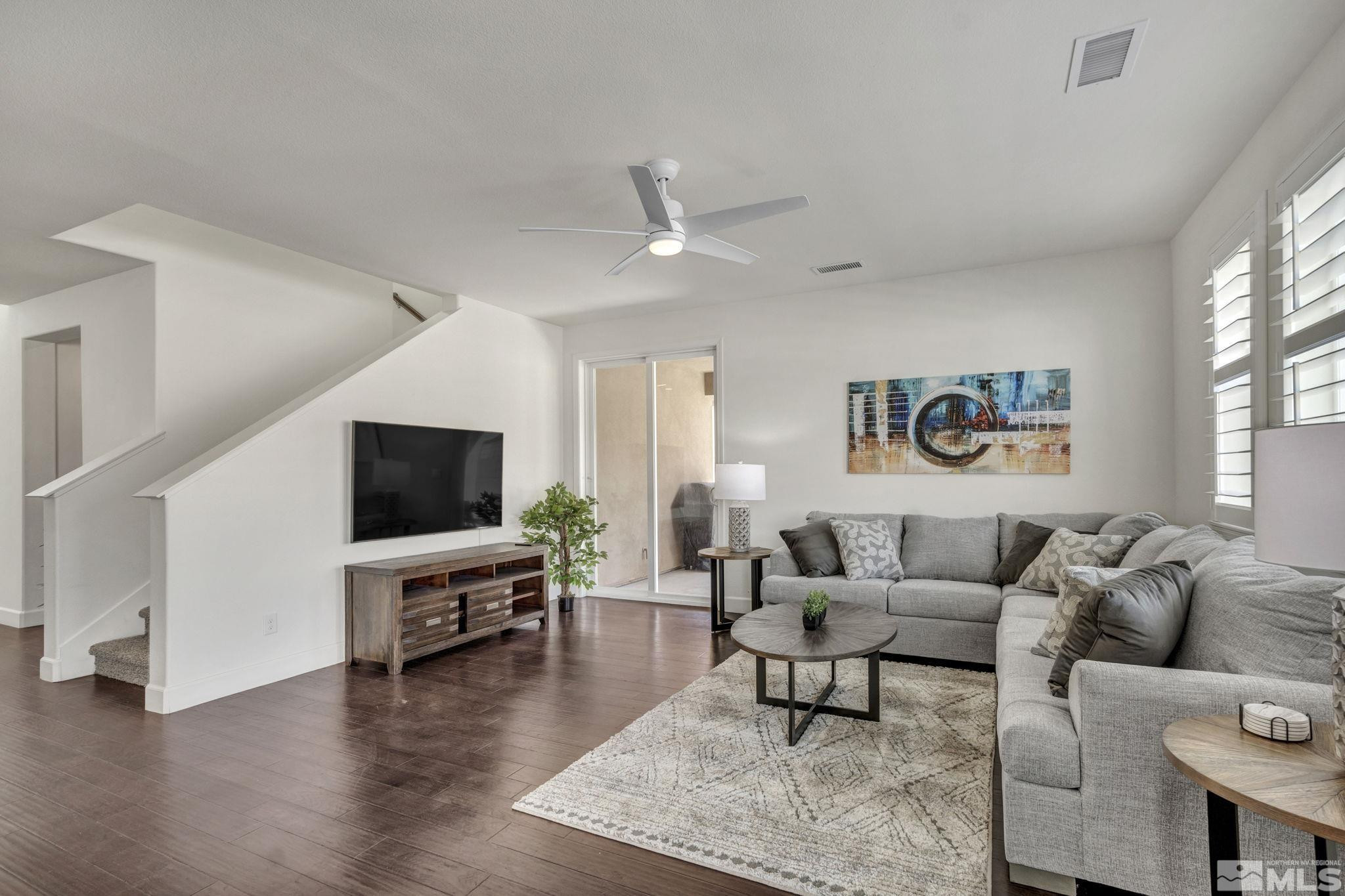 10345 Rollins Drive Reno, NV 89521 - Photo 11 of 39 a living room with furniture and a flat screen tv