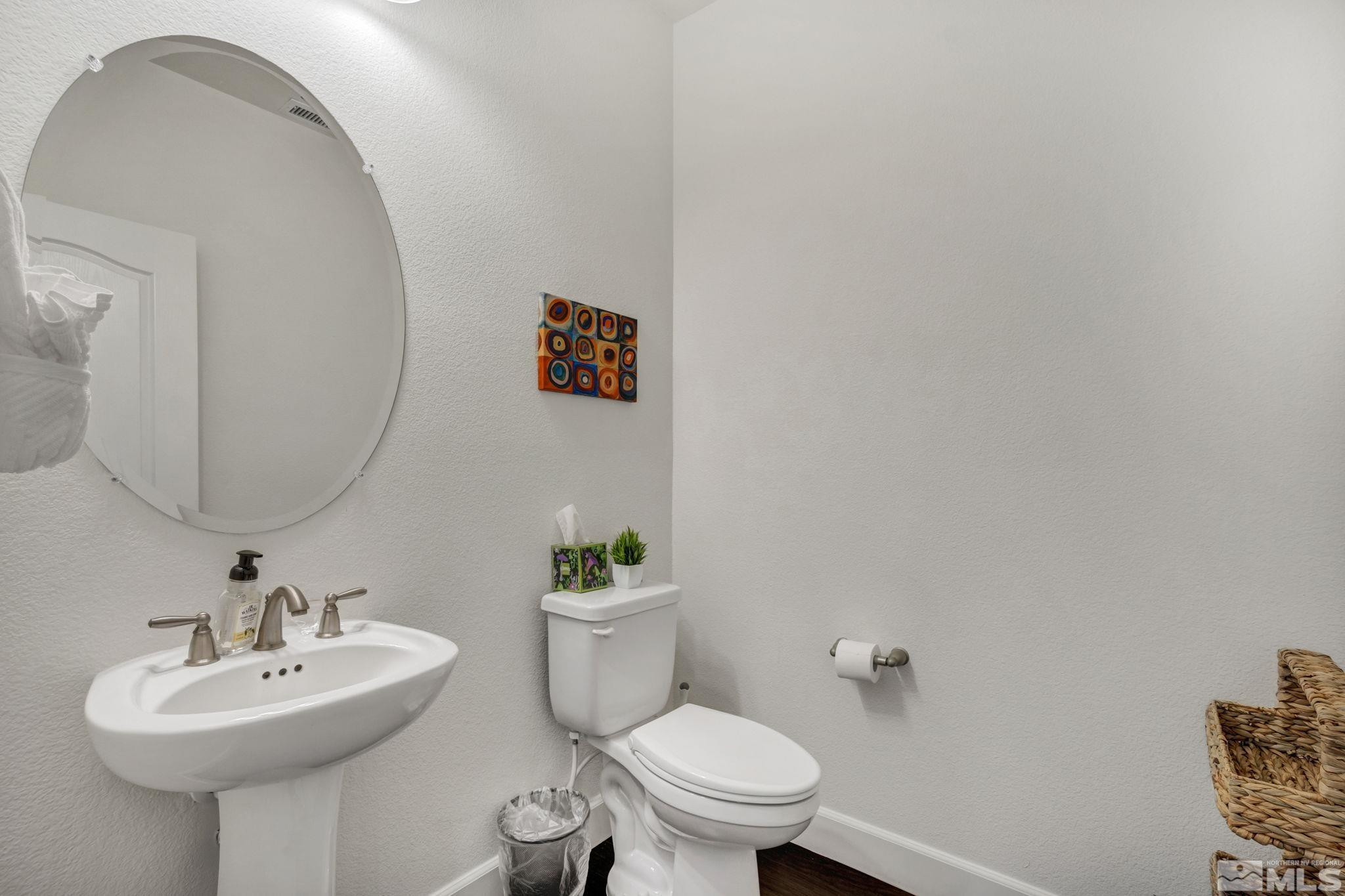 10345 Rollins Drive Reno, NV 89521 - Photo 14 of 39 a bathroom with a toilet sink and mirror