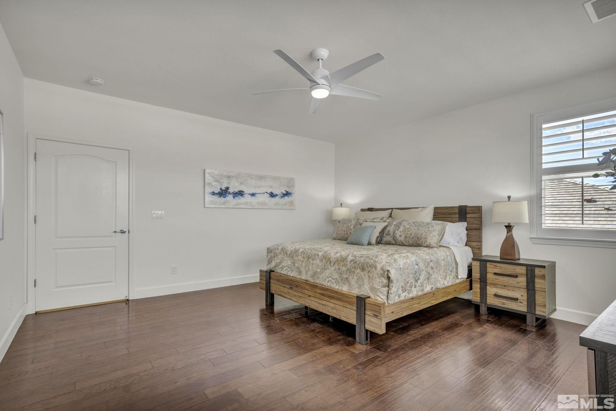 10345 Rollins Drive Reno, NV 89521 - Photo 17 of 39 a spacious bedroom with a bed and a window
