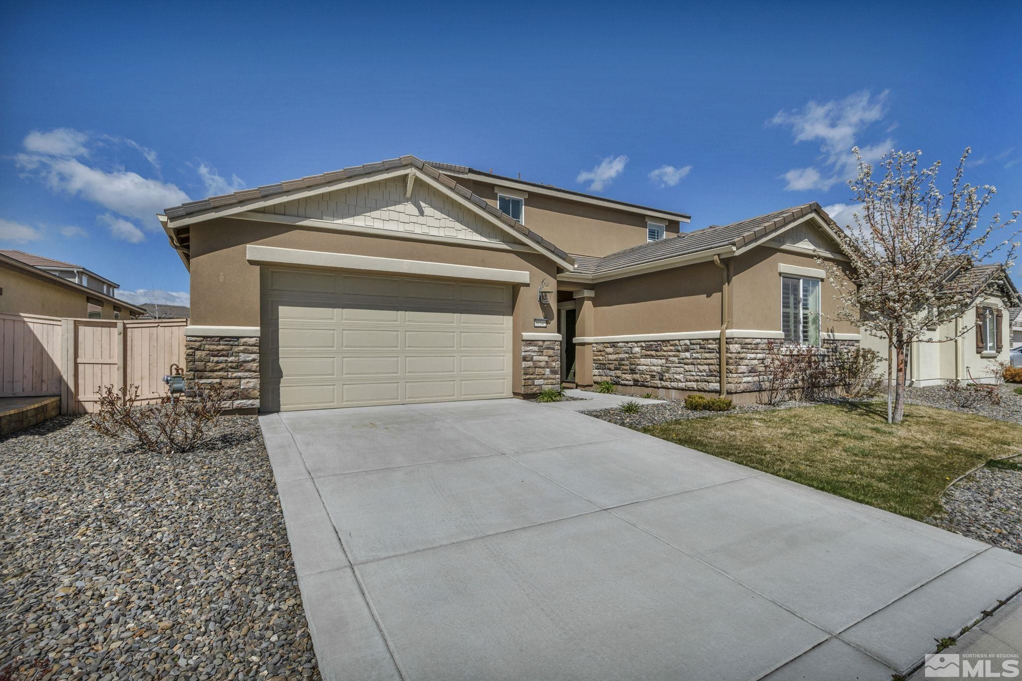 10345 Rollins Drive Reno, NV 89521 - Photo 2 of 39 a front view of a house with garden