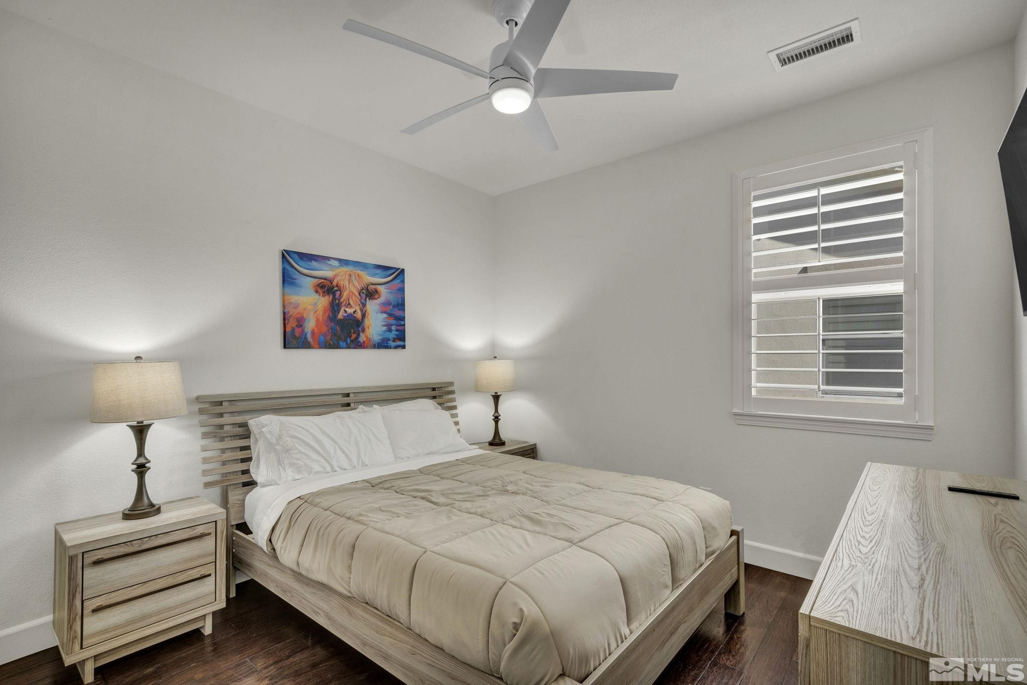 10345 Rollins Drive Reno, NV 89521 - Photo 24 of 39 a bedroom with a bed and a night stand