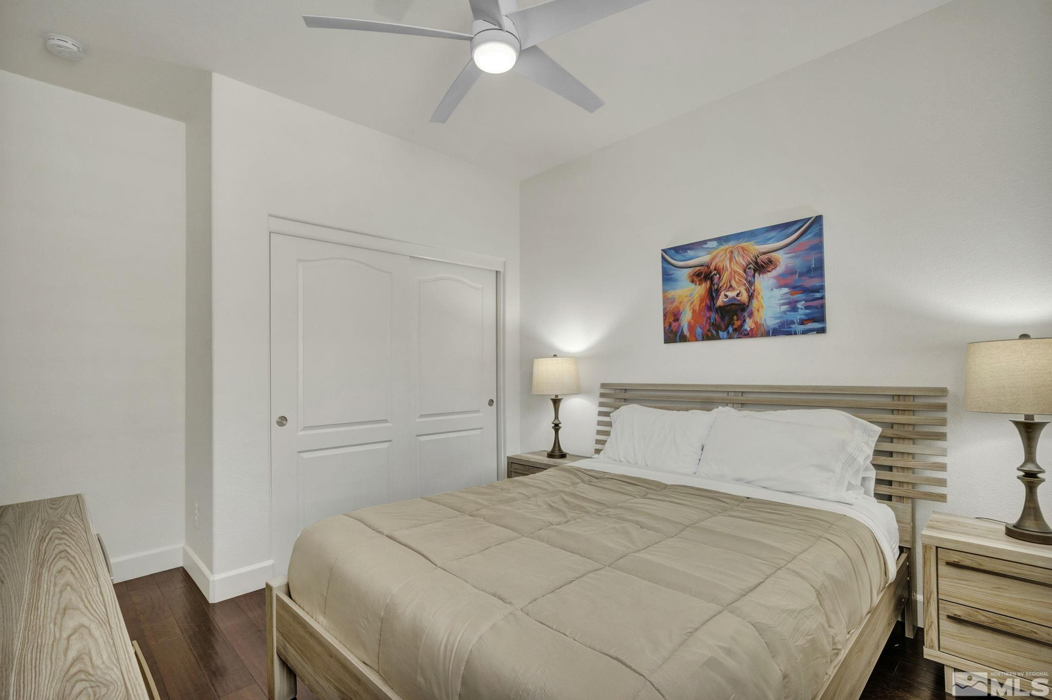 10345 Rollins Drive Reno, NV 89521 - Photo 25 of 39 a bedroom with a bed and a painting on the wall