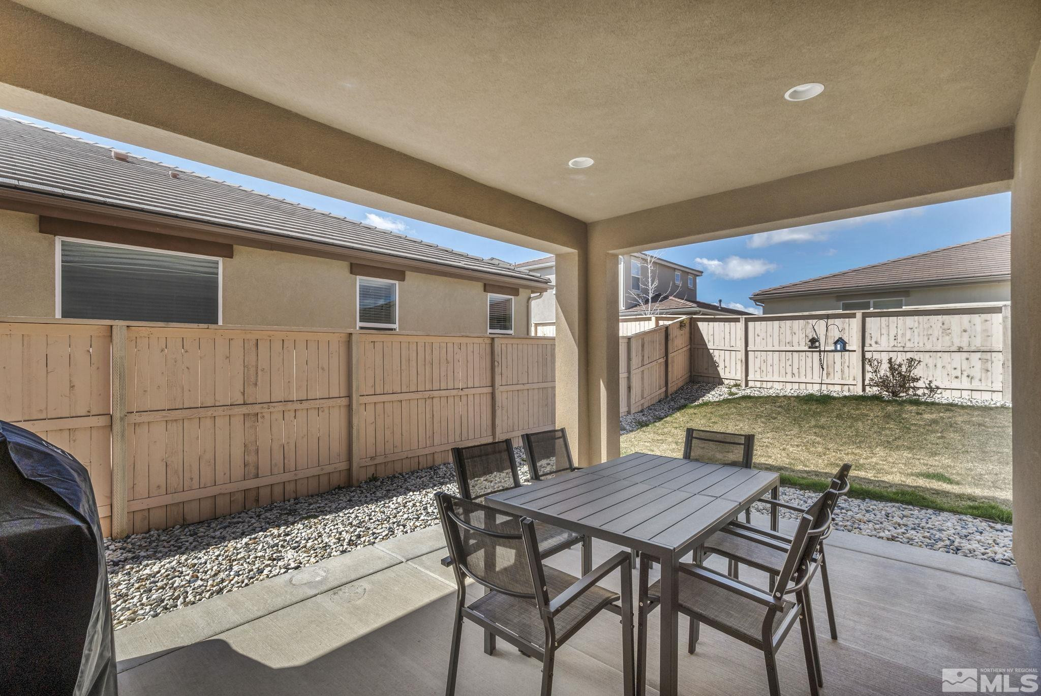 10345 Rollins Drive Reno, NV 89521 - Photo 37 of 39 a backyard of a house with yard and outdoor seating