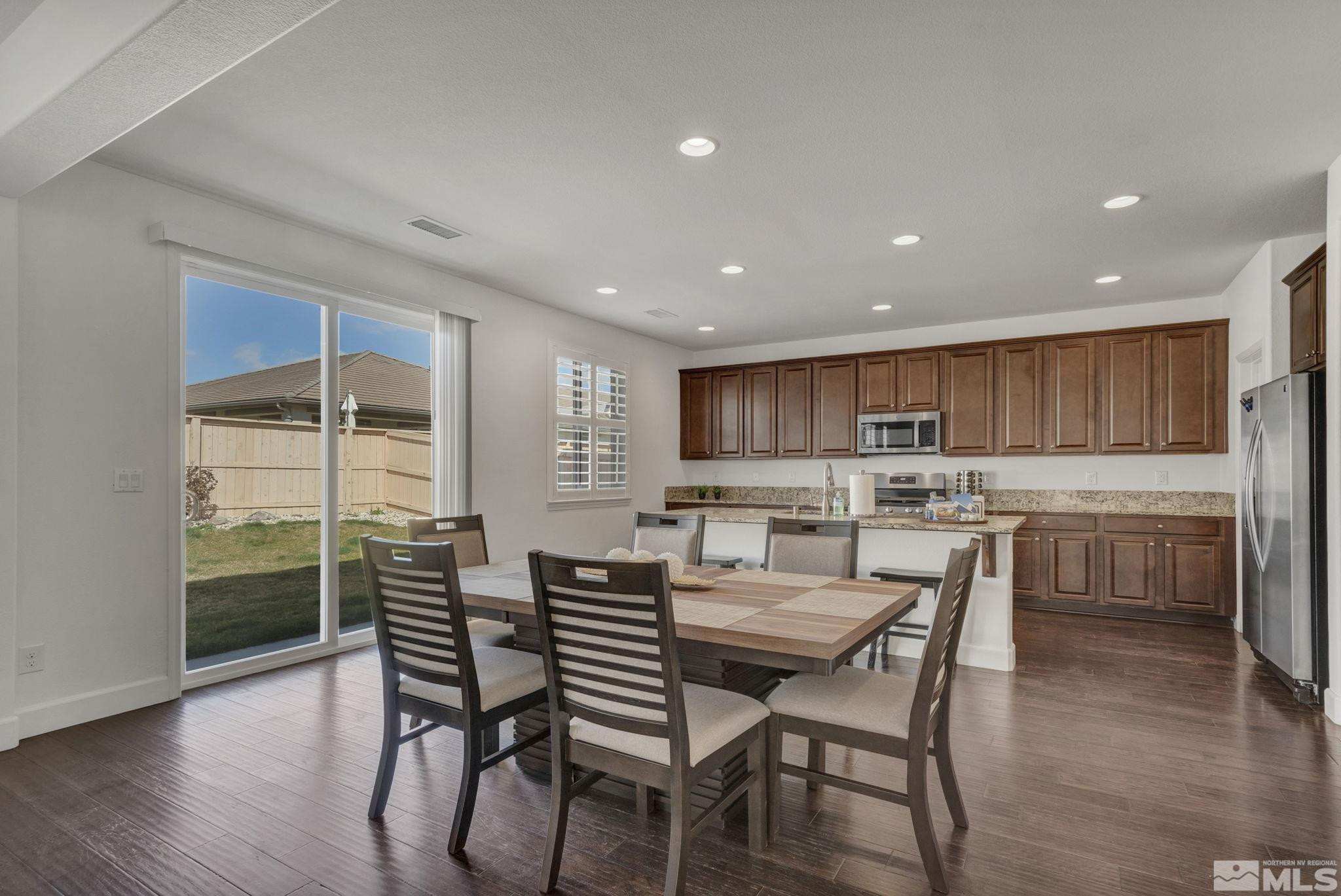 10345 Rollins Drive Reno, NV 89521 - Photo 6 of 39 a kitchen with a table and chairs in it