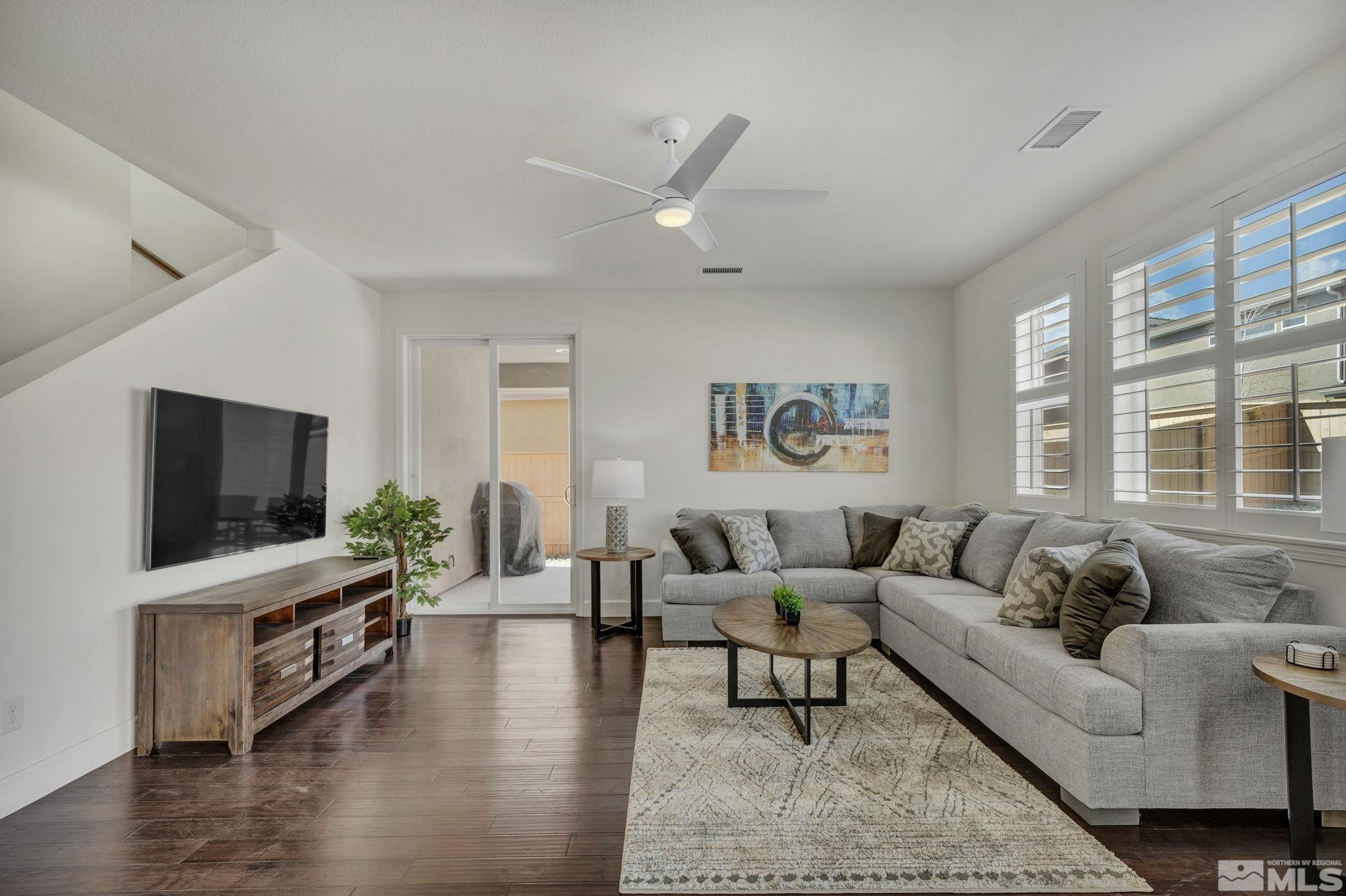 10345 Rollins Drive Reno, NV 89521 - Photo 9 of 39 a living room with furniture and a flat screen tv