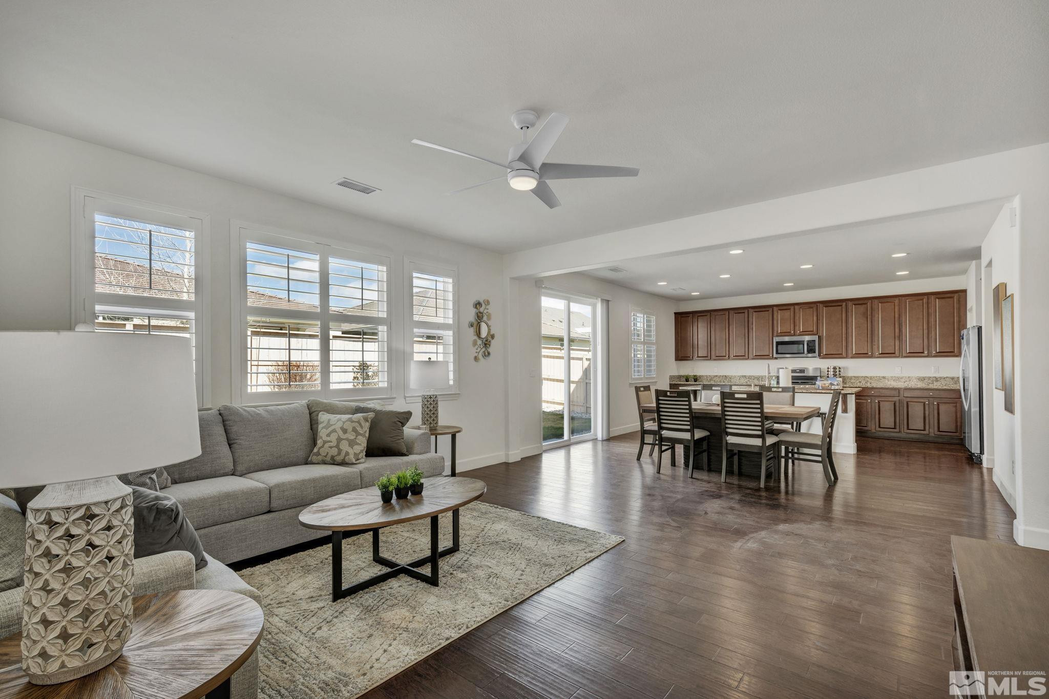 10345 Rollins Drive Reno, NV 89521 - Photo 10 of 39 a living room with furniture and a large window