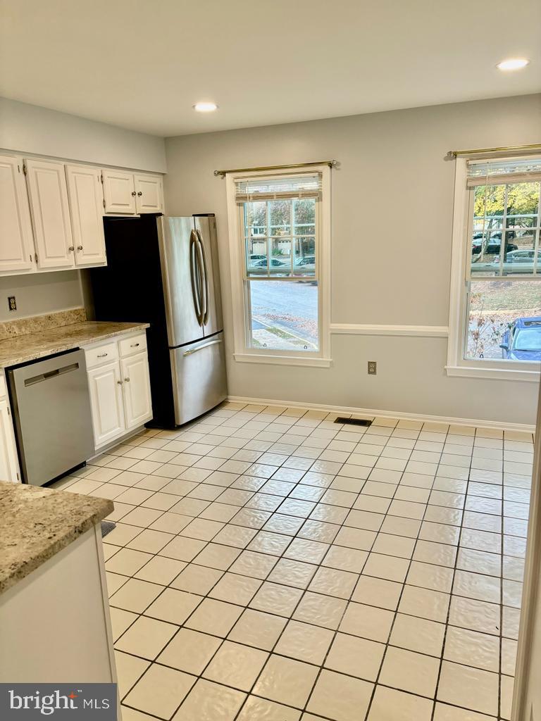 6803 Wild Rose Court Springfield, VA 22152 - Photo 10 of 49 a room with a bed and a refrigerator