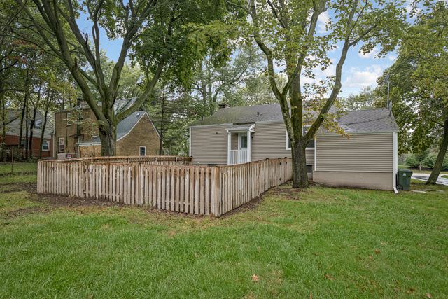 1211 Telegraph Road Lake Forest, IL 60045 - Photo 18 of 21 a view of a wooden fence and a tree