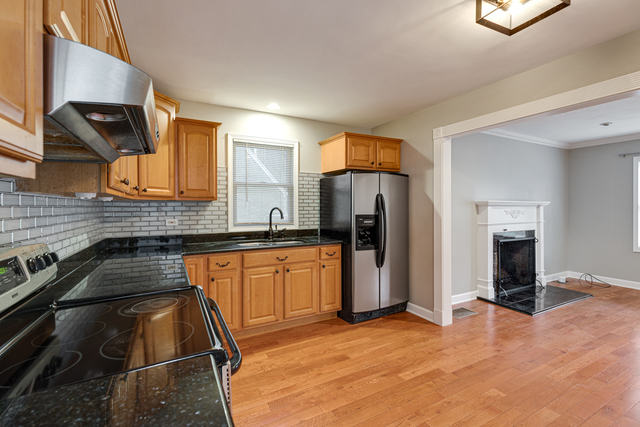 1211 Telegraph Road Lake Forest, IL 60045 - Photo 8 of 21 a kitchen with stainless steel appliances granite countertop a refrigerator and a sink