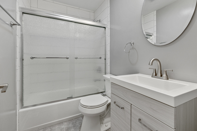 1211 Telegraph Road Lake Forest, IL 60045 - Photo 10 of 21 a bathroom with a sink a toilet and shower