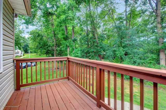 a view of balcony with wooden floor