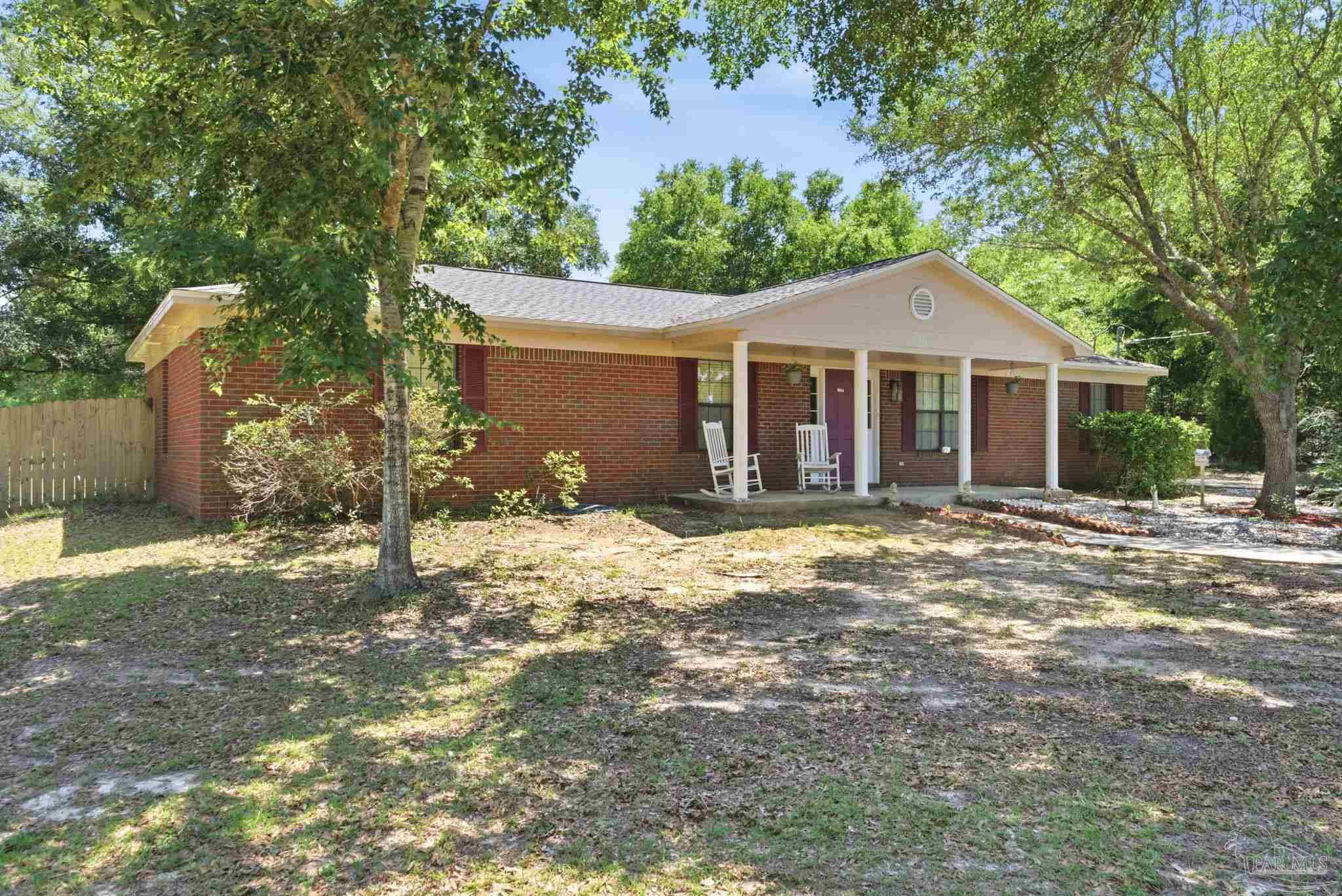 5121 Keyser Mill Road Baker, FL 32531 - Photo 3 of 52 a view of a house with a yard and large tree