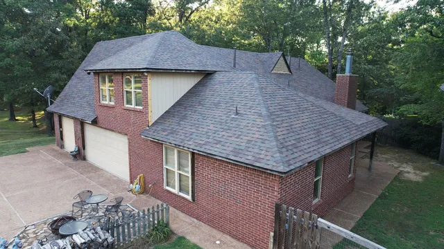 a aerial view of a house with a yard